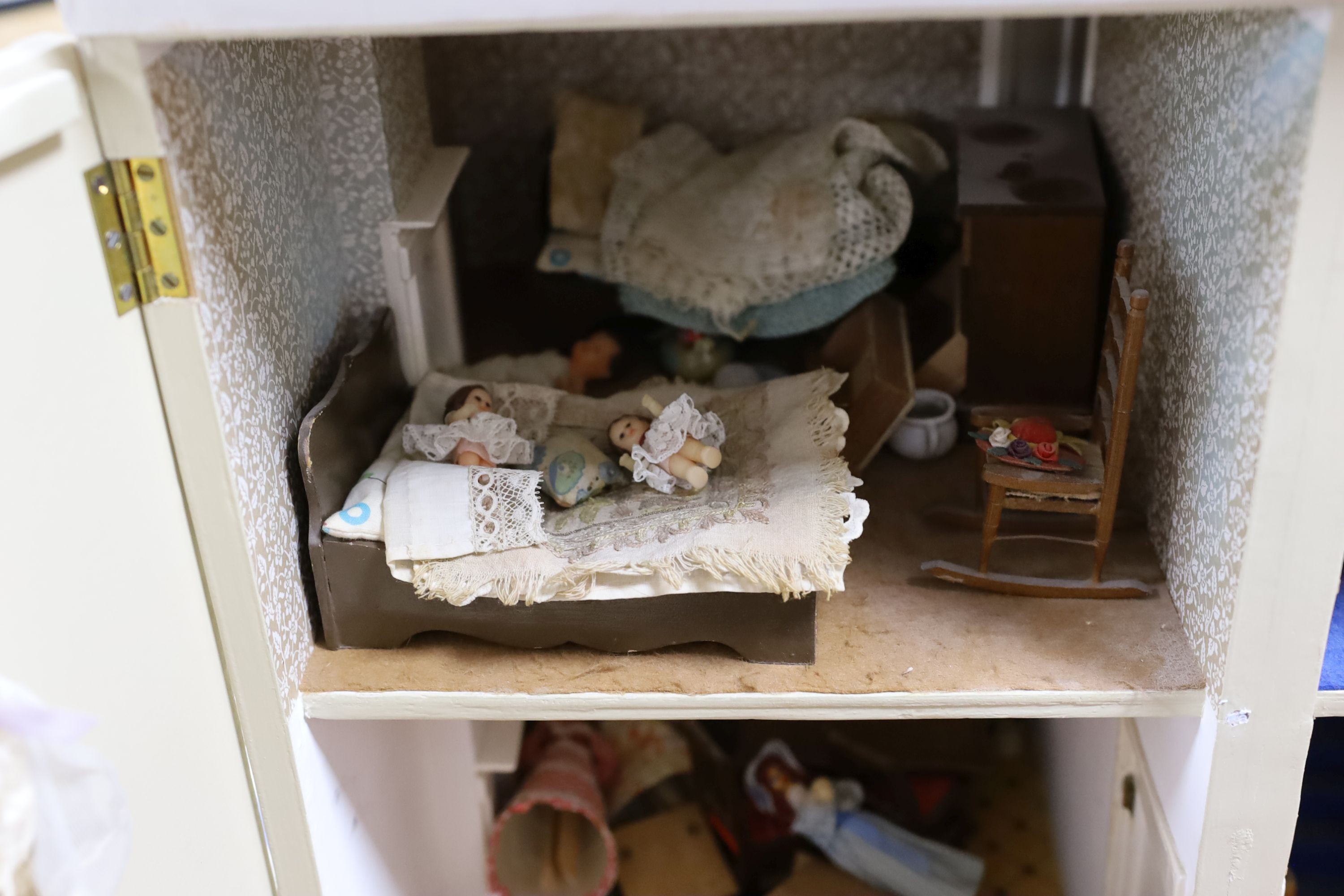 A dolls house, length 74cm, depth 39cm, height 66cm